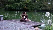 Fur coat and rubber boots - naked in the park