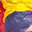 Sonja wearing a sexy blue/purple own designed shiny nylon shorts and a yellow rain jacket posing on the red sofa (Pics)
