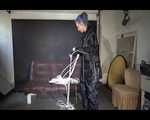 Watching Mara wearing sexy black rainwear during sorting her ropes for the next bondage session (Video)