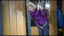 Pia tied with ropes overhead and gagged with a ballgag wearing sexy rain pants and a rain jacket (Video)
