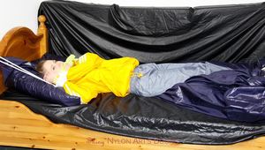 Samanthy bound and gagged in shiny nylon rainwear