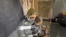 Alice taped to a Chair and tapegagged in shiny nylon Downjacket