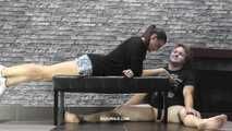 Viktoria rests on the slave's balls and blows smoke into his mouth