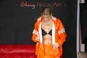 Watching Pia putting on a wonderful supersexy shiny nylon rainssuit in orange (Pics)