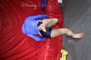 Watching sexy Sonja wearing a supersexy oldschool blue shiny nylon shorts and a lightblue rain jacket during her workout with barbells (Pics)