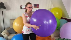 sexy teasing and popping balloons with fingernails and wooden stick and topless