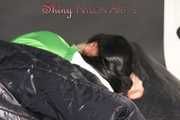 Lucy wearing sexy green shiny nylon shorts and a green rain jacket lolling on bed with a special cover (Pics)