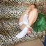 Leonie tied and gagged on a sofa wearing a sexy green shiny nylon shorts and a green rain jacket (Pics)