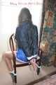 Stella being tied and gagged with ropes and a clothgag on a chair wearing a sexy shiny nylon short and a rain jacket (Pics)