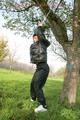 Jill tied and gagged outdoor on a tree wearing a sexy black downjacket and a black rain pants (Pics)