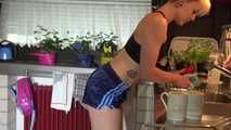 Watching sexy COURTNEY wearing a darkblue shiny nylon shorts and a top while preparing coffee and doing her housework (Video)