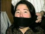 25 YEAR OLD ASIAN MAI-LING IS MOUTH STUFFED, CLEAVE GAGGED, HANDGAGGED, OTM GAGGED, TAPE GAGGED & TIGHTLY TIED TO A CHAIR  (D47-15)