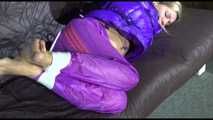 ***HOT SANDRA*** tied, gagged and hooded with ropes and a cloth gag on bed wearing a sexy purple shiny nylon down jacket and a rain pant (Video)