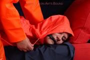 Julia tied and gagged by Alina in heavy raingear