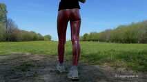 Red leggings on a green meadow