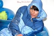 Simone tied and gagged in a shiny nylo skisuit