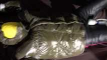Watching Jill being tied on a bed wearing a shiny nylon rain jacket and a down jacket as well as a rain pants being double hooded and gagged with a ballgag (Video)