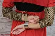 Damsel Sophia cuffed with special rigid cuffs