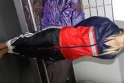 Samantha tied and gagged on bed wearing shiny nylon rainwear (Pics)