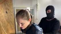 Rachel Adams bound and pantygagged in shiny nylon Rainwear