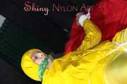 Watching sexy Pia being tied and gagged with ropes on a bed and a clothgag wearing sexy yellow shiny nylon rainwear (Pics)