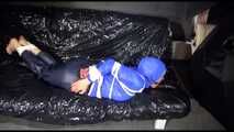 SANDRA tied, gagged and hooded with ropes and a ballgag on a sofa wearing sexy rainwear (Video)